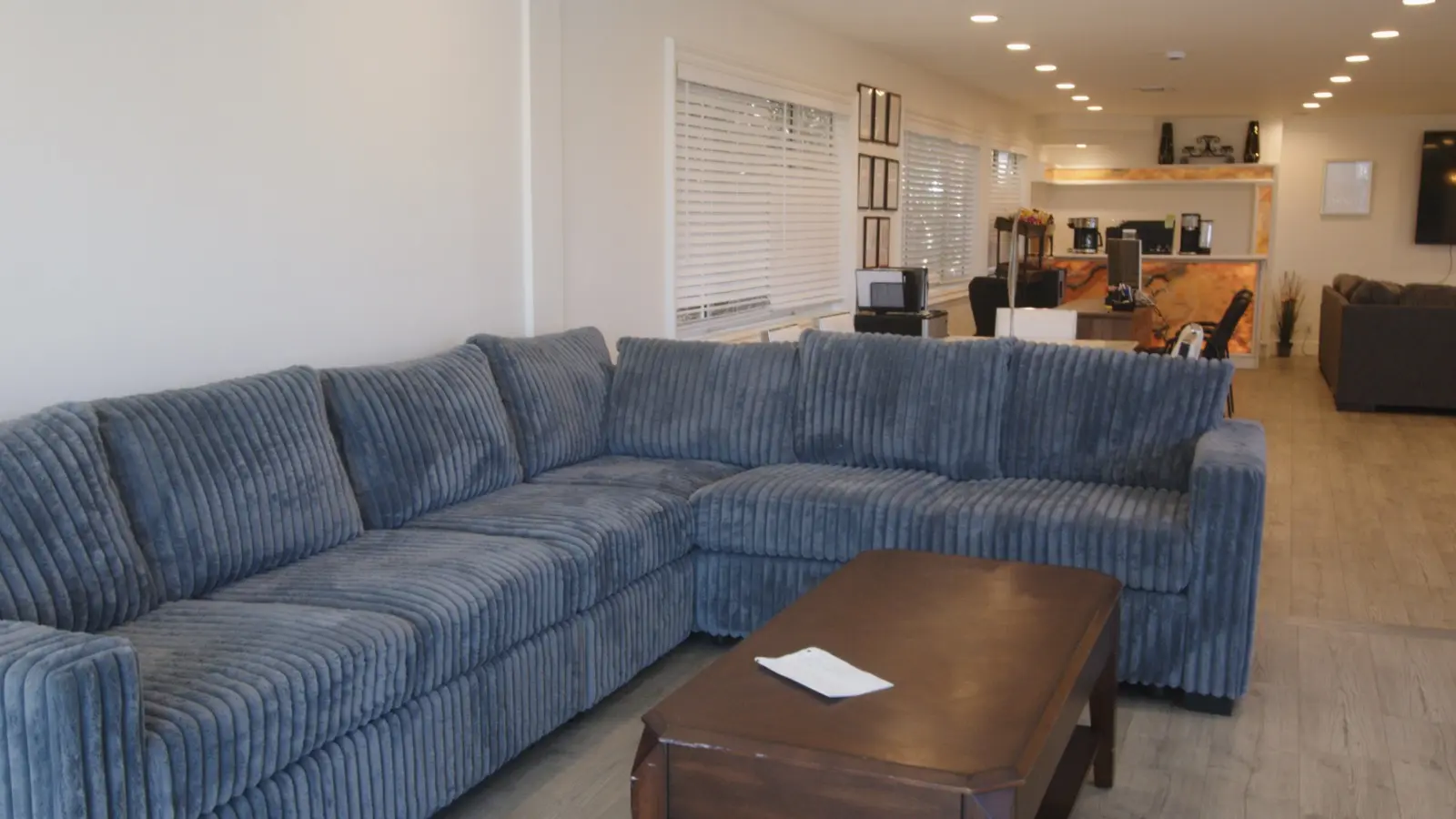 Therapy lounge with blue sofa at the LACATC facility in Encino